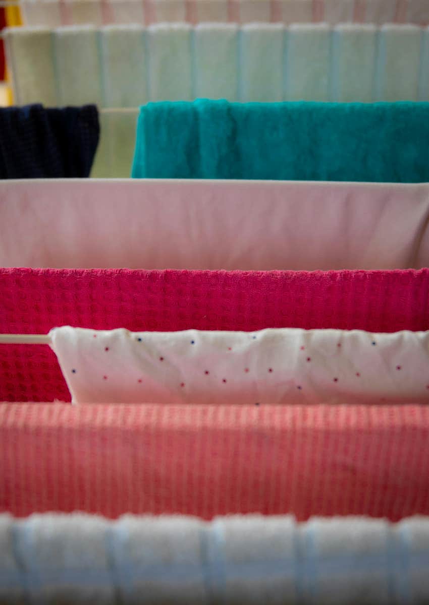 laundry drying on racks in the living room