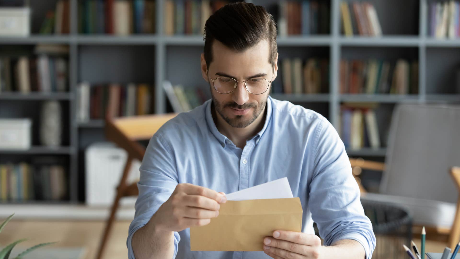 man mailing a love letter as a way to say i love you