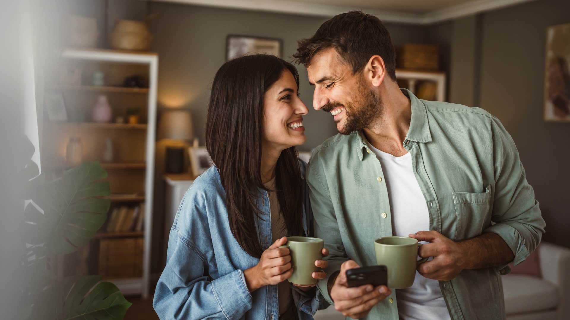 woman in jean jacket creating a warm environment as man smiles
