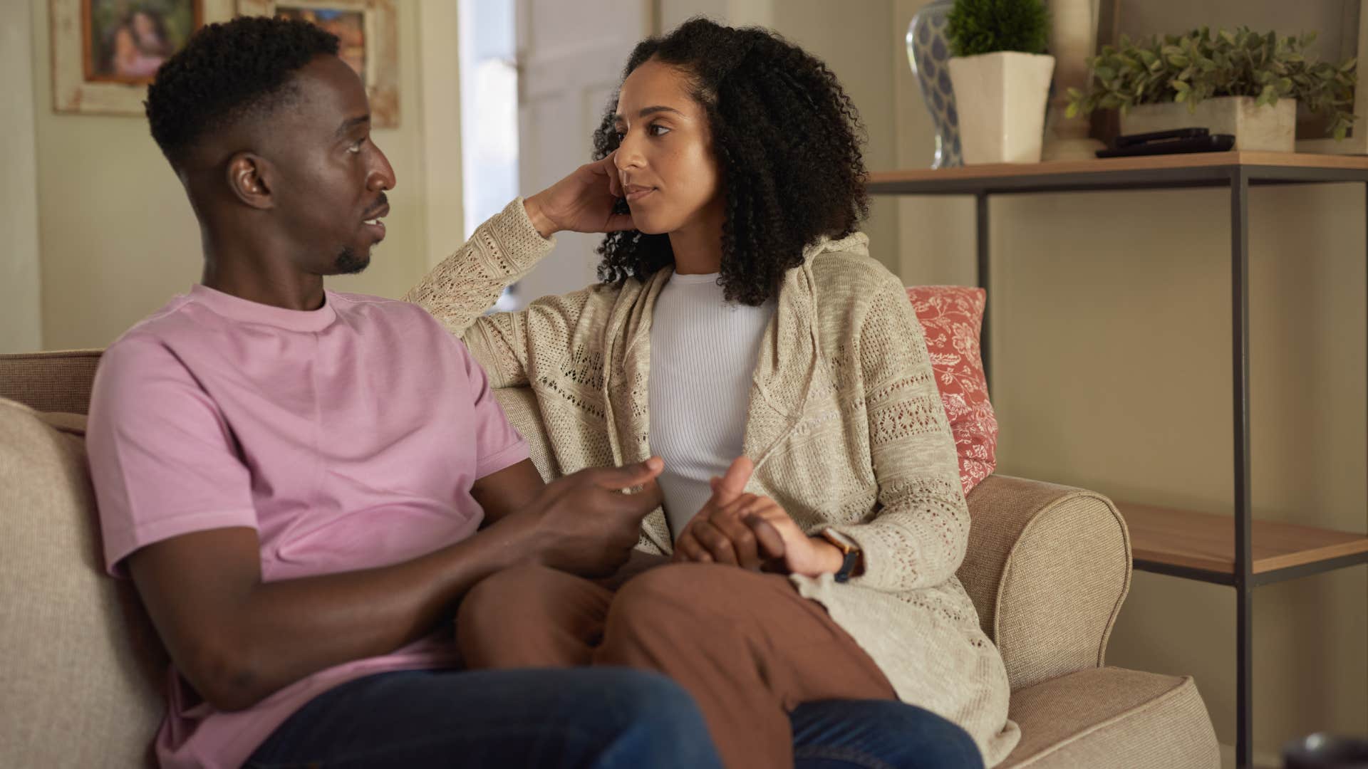 woman in brown pants learning to speak his love language as man in pink talks