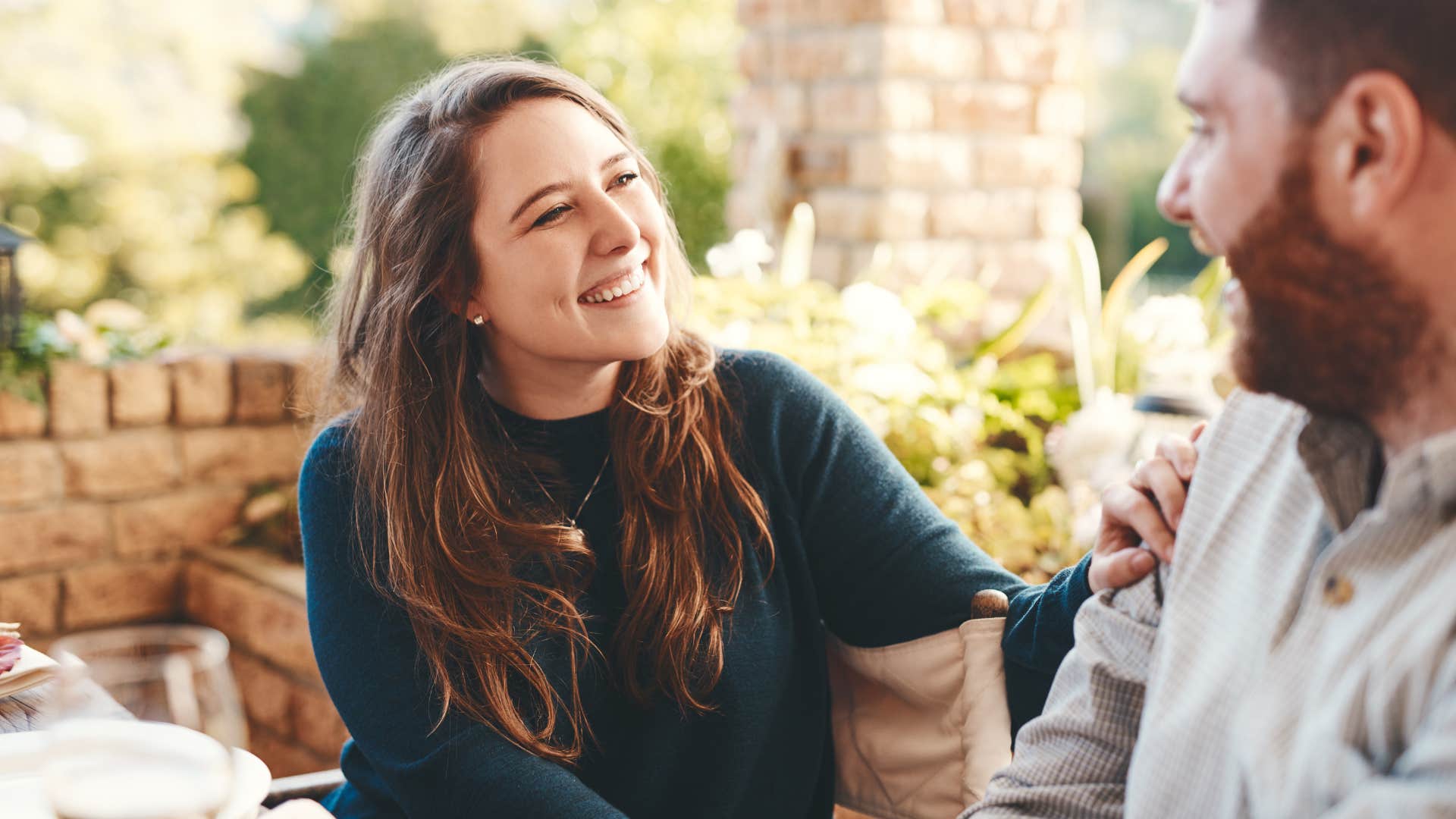 woman in green shirt saying thank you without being asked