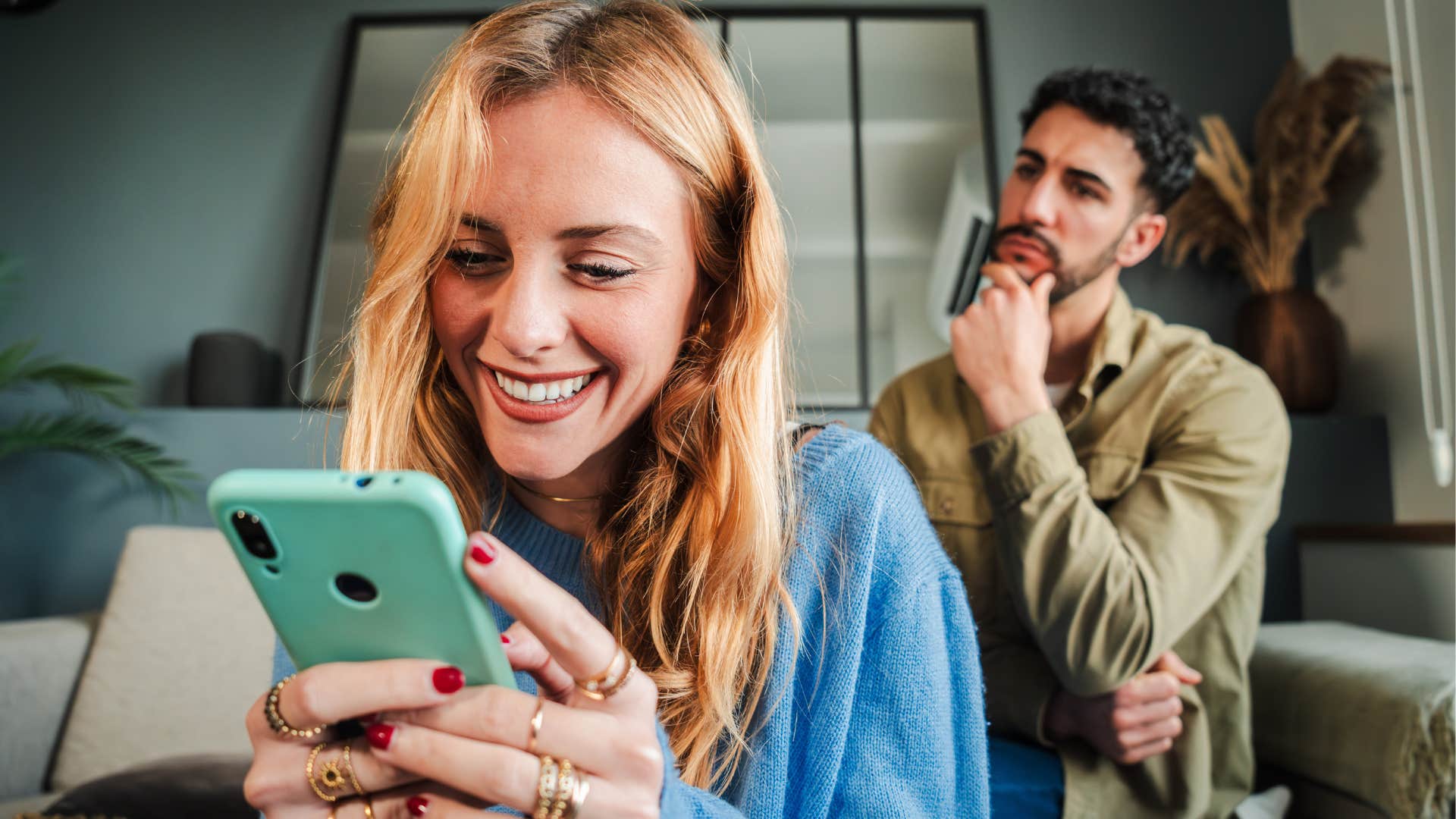 Woman who's always on their phone sitting next to her husband.