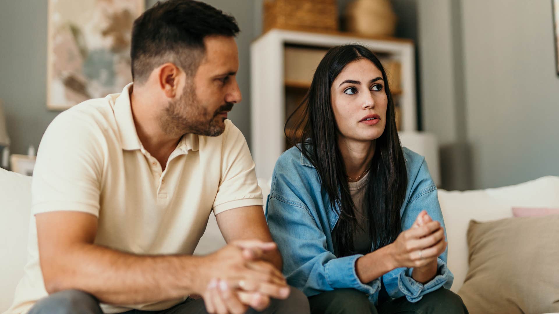 Woman who compares to other men and relationships sitting at home.