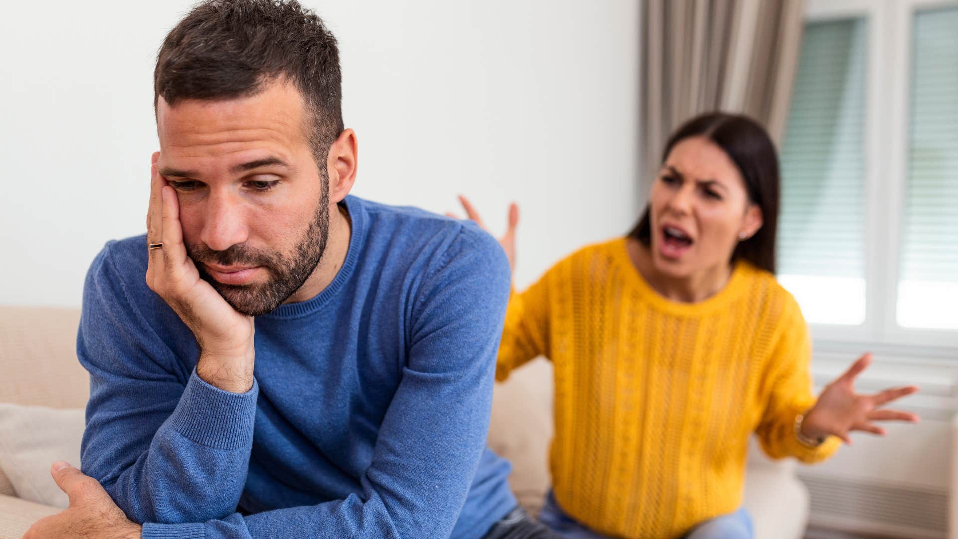 Woman who's more critical than supportive arguing with her husband.