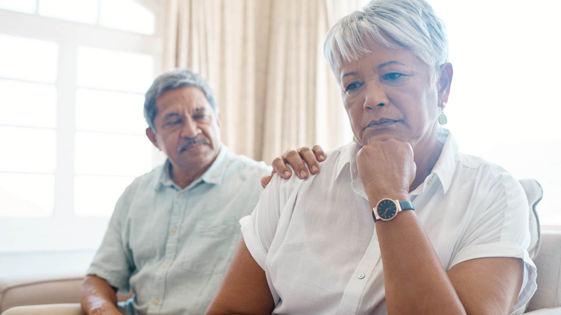 Woman who's stopped being affectionate turned away from her husband.