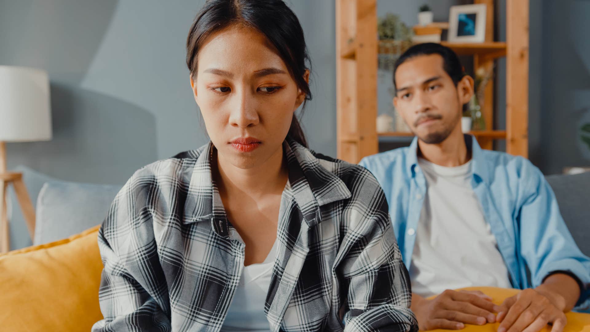 Woman who doesn't flirt turned away from her husband.