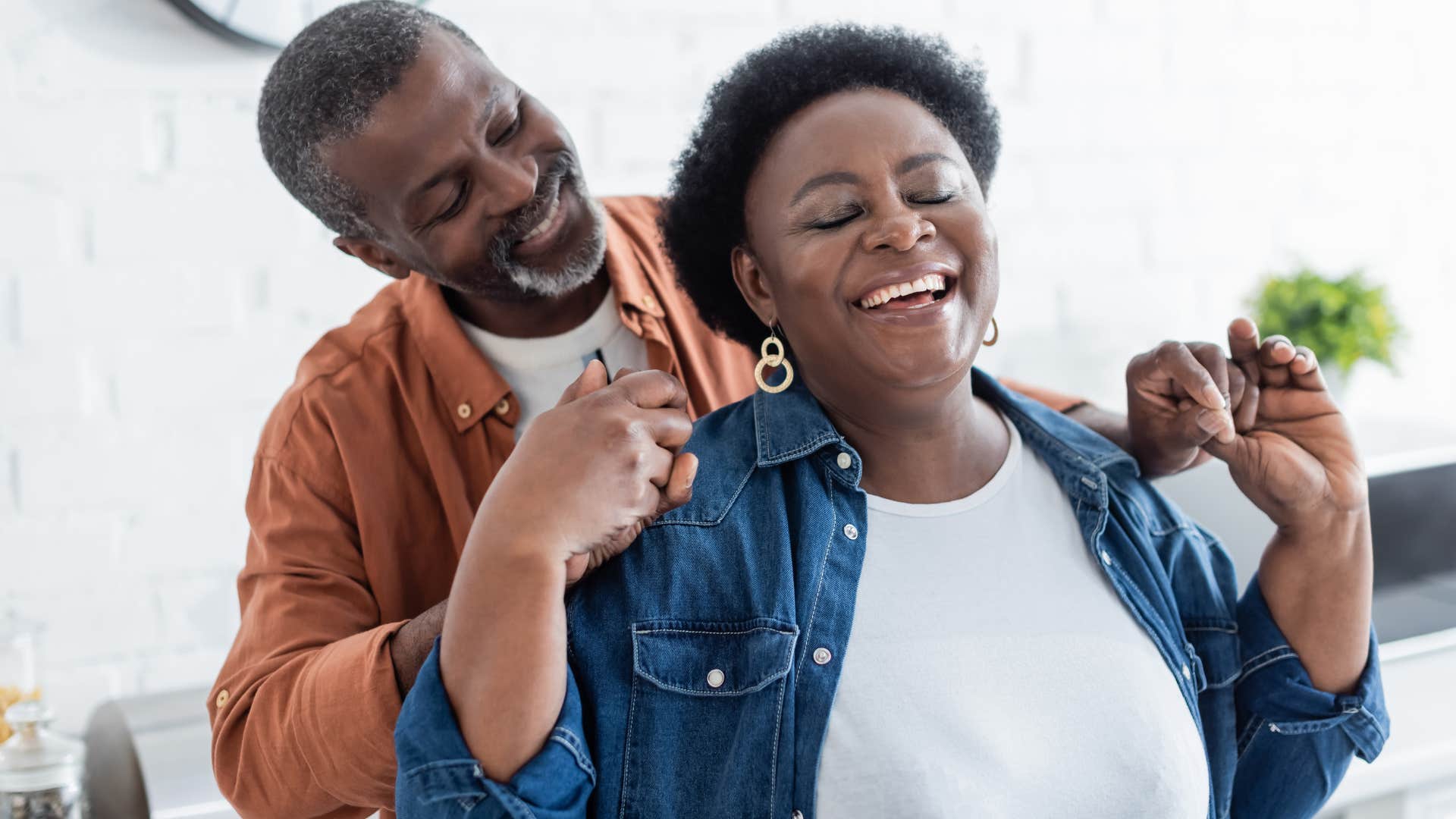 Man saying "I'm so grateful for you" while dancing with his wife.
