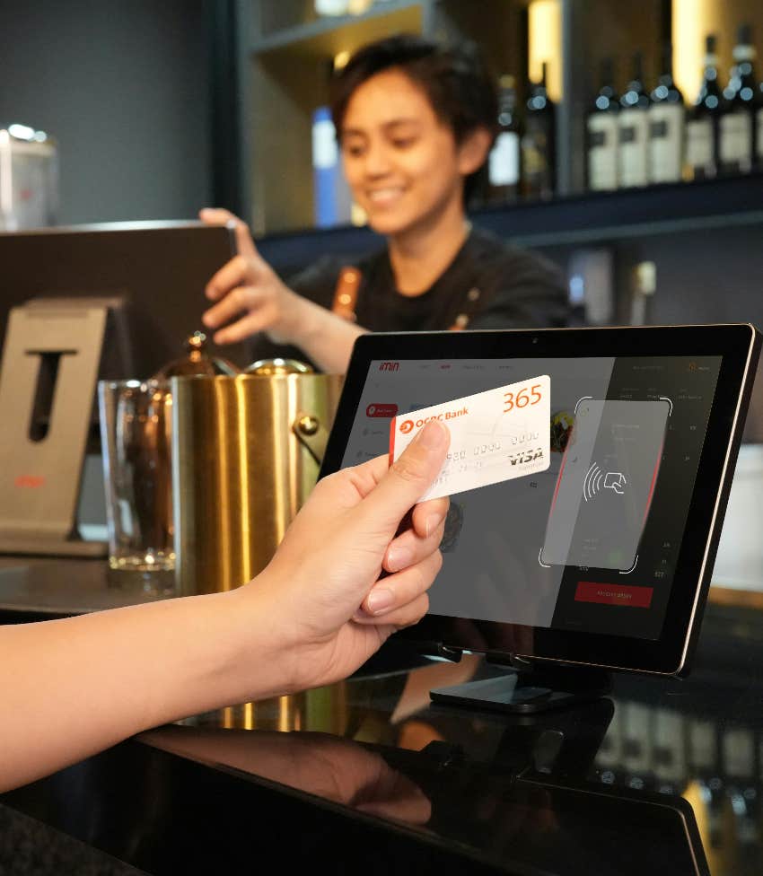 person paying for a meal at a restaurant