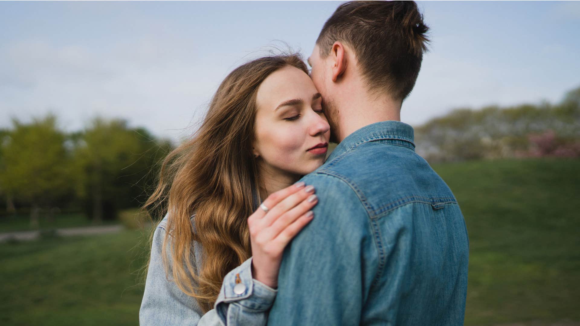 woman supporting her man's dreams unconditionally as she hugs him 