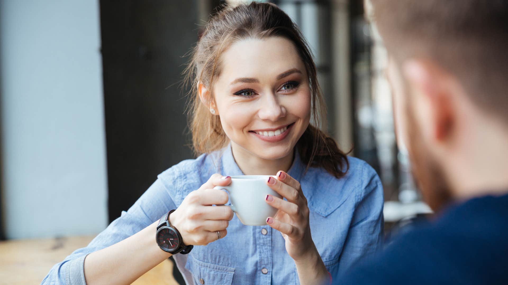 woman smiling at man on a first date