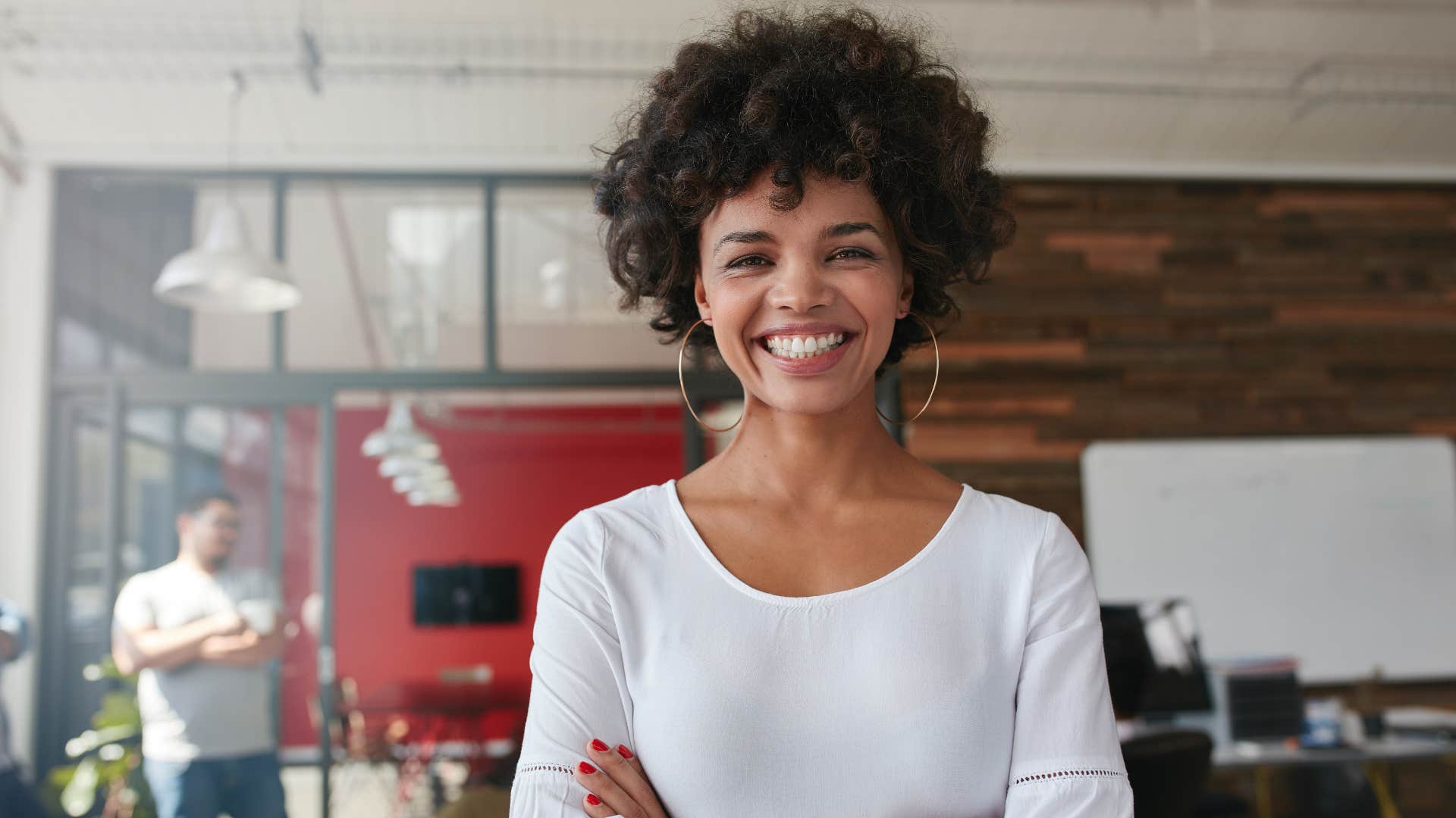 woman in white crossing arms while thinking she's just jealous of you