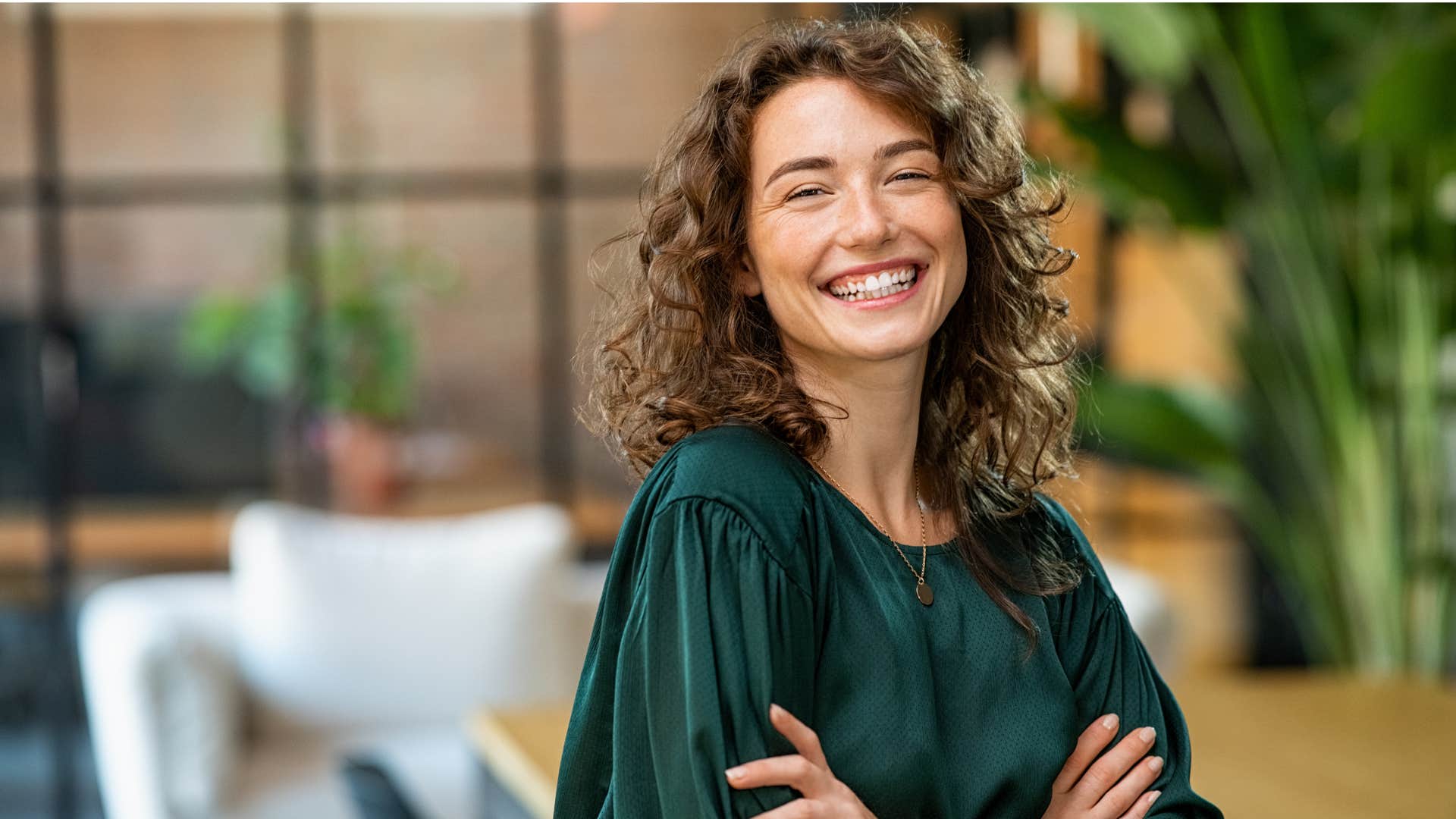 woman in green shirt smiling while she says i'm not like everyone else
