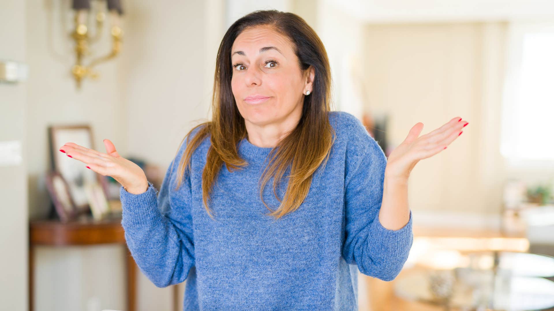 woman in blue sweater saying i'm just saying what everyone else is thinking while shrugging