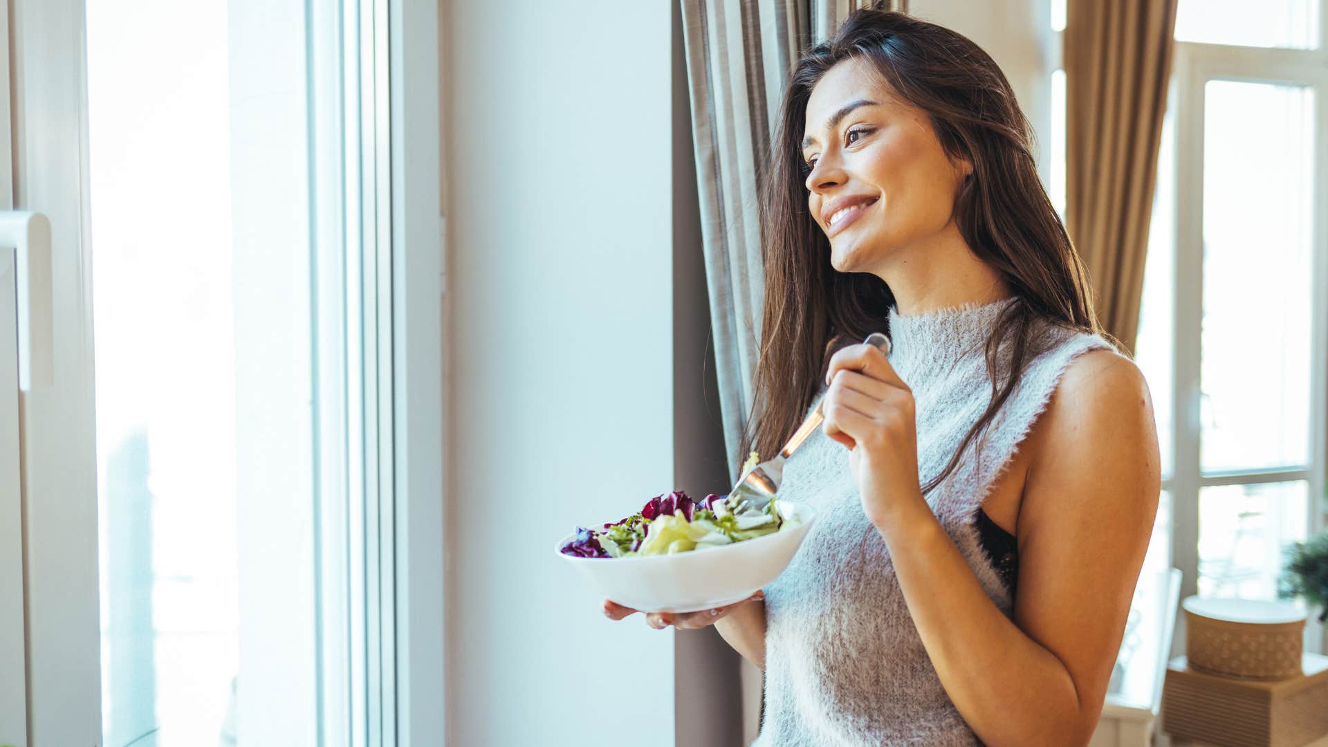 a woman avoids poor diets but eats healthy