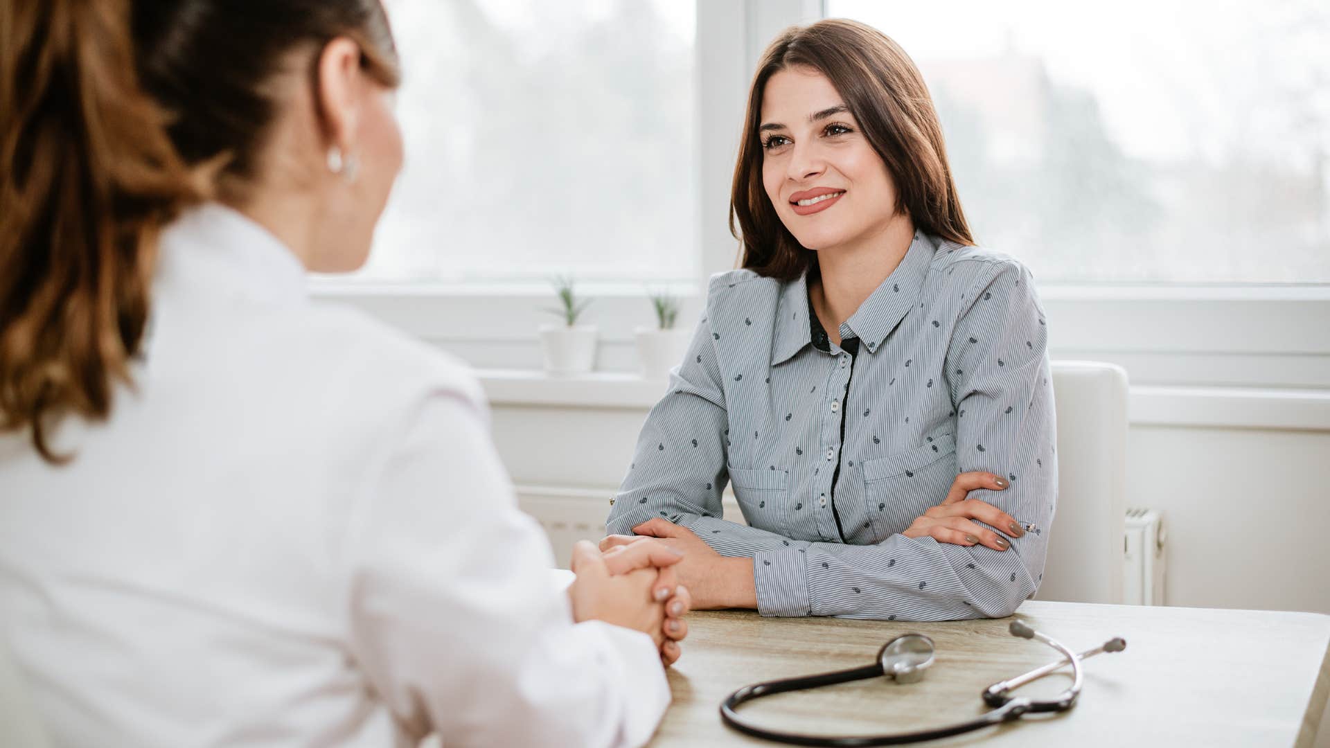 a woman goes to her doctor for regular checkups