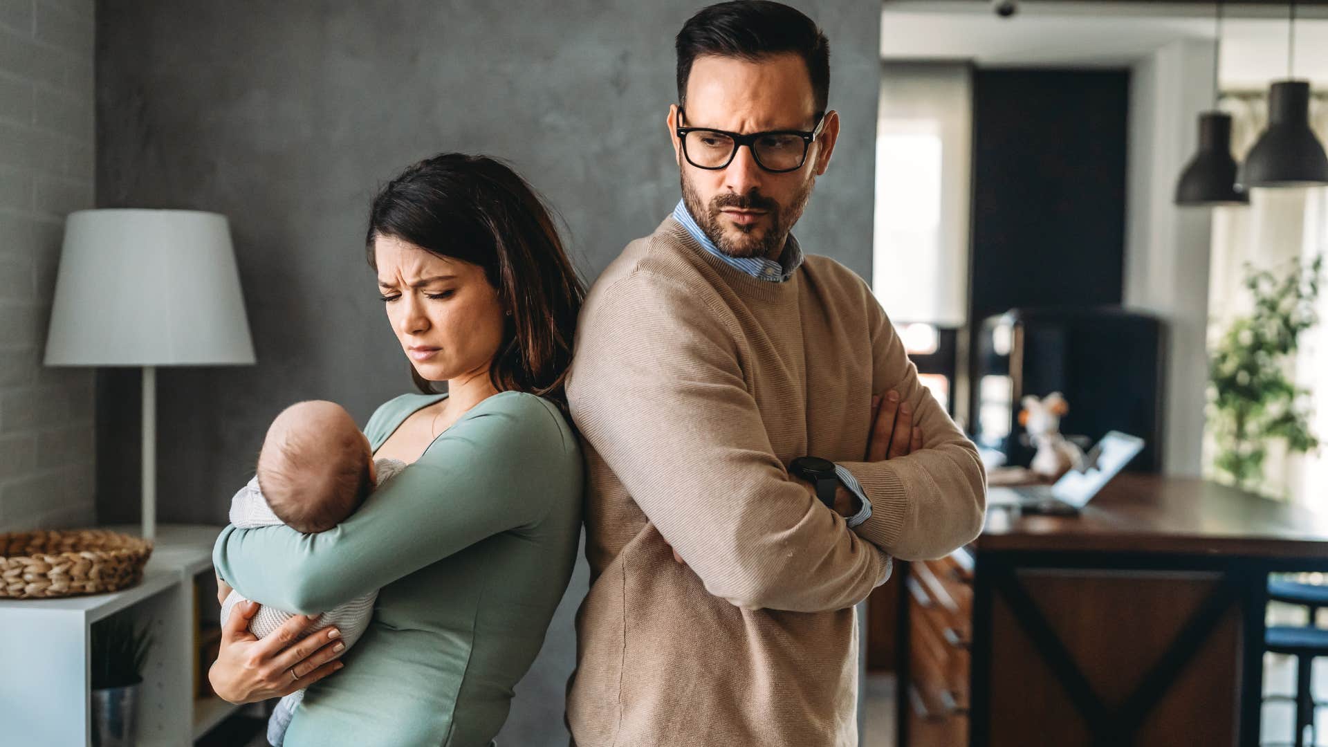 Man turned away from his wife who doesn't ask for his input.
