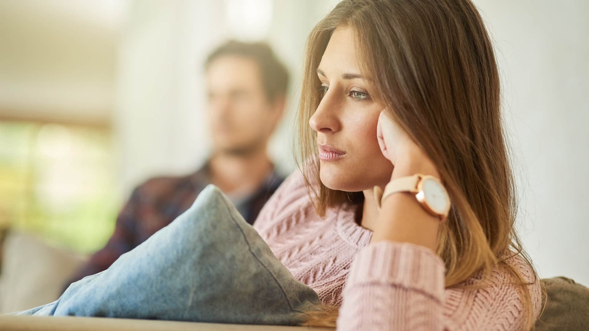 Woman who stops asking about his day looking away from her partner.