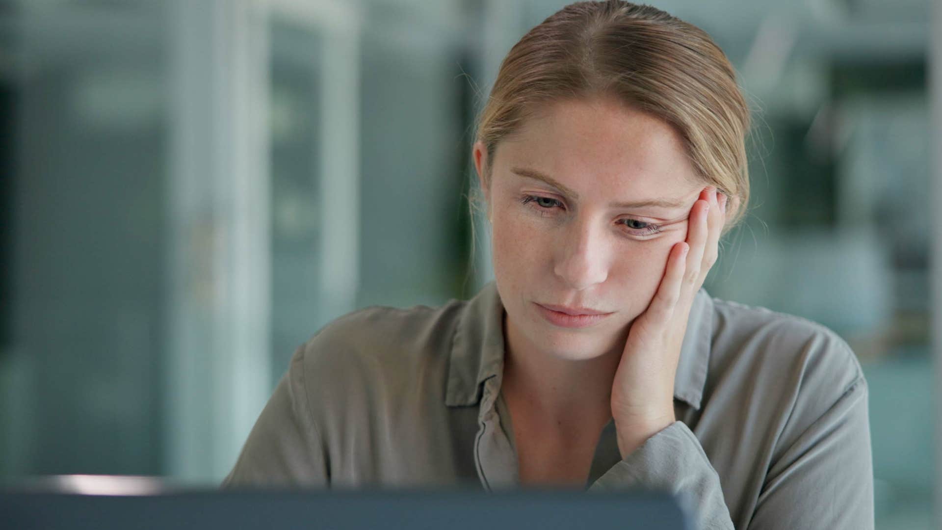 woman working late to avoid spending time at home