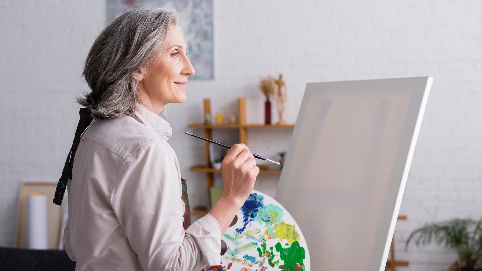 woman being creative and painting