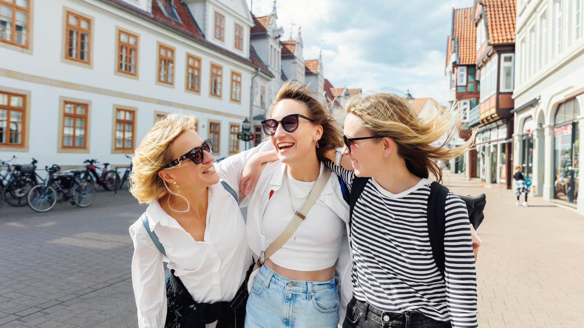group of women walking together down street