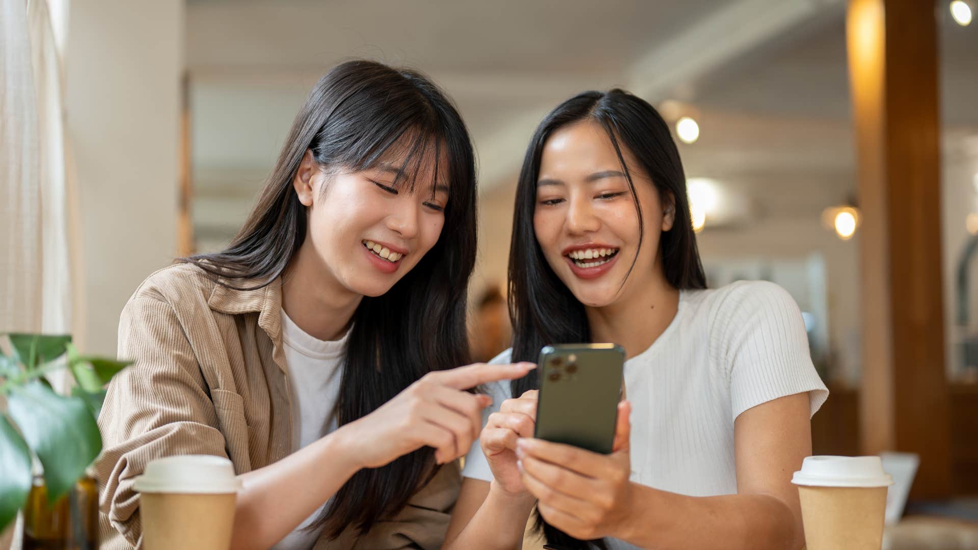 two women hanging out at cafe