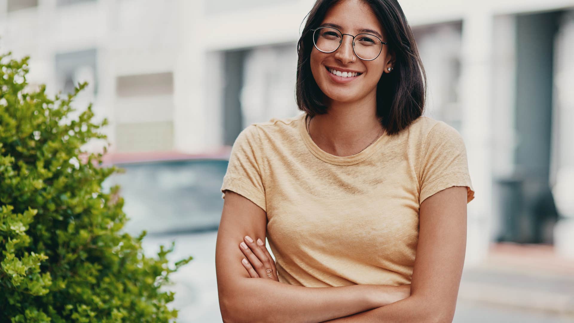 woman smiling with arms crossed