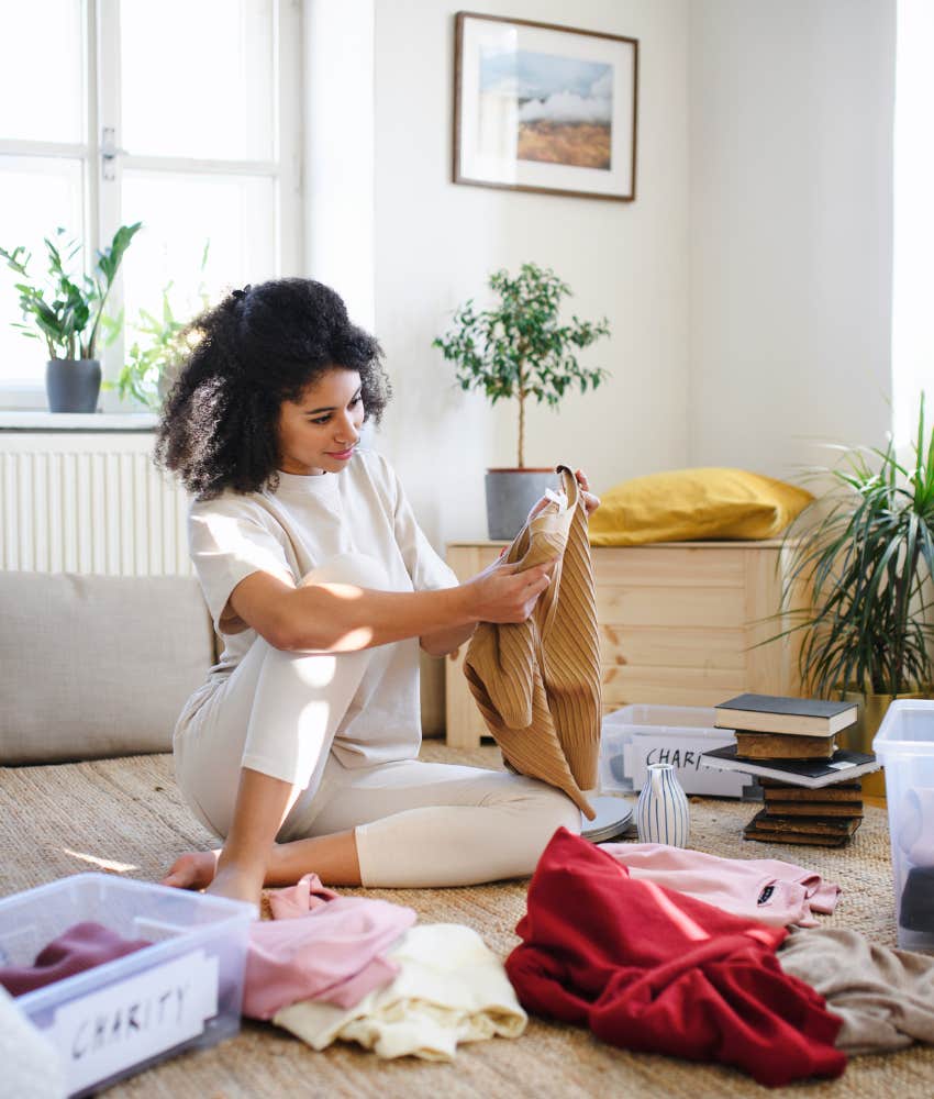 Happy woman declutters home