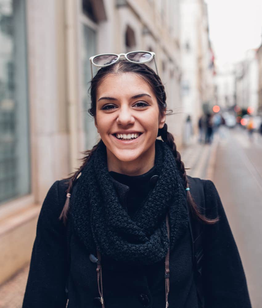Happy woman goes for walk