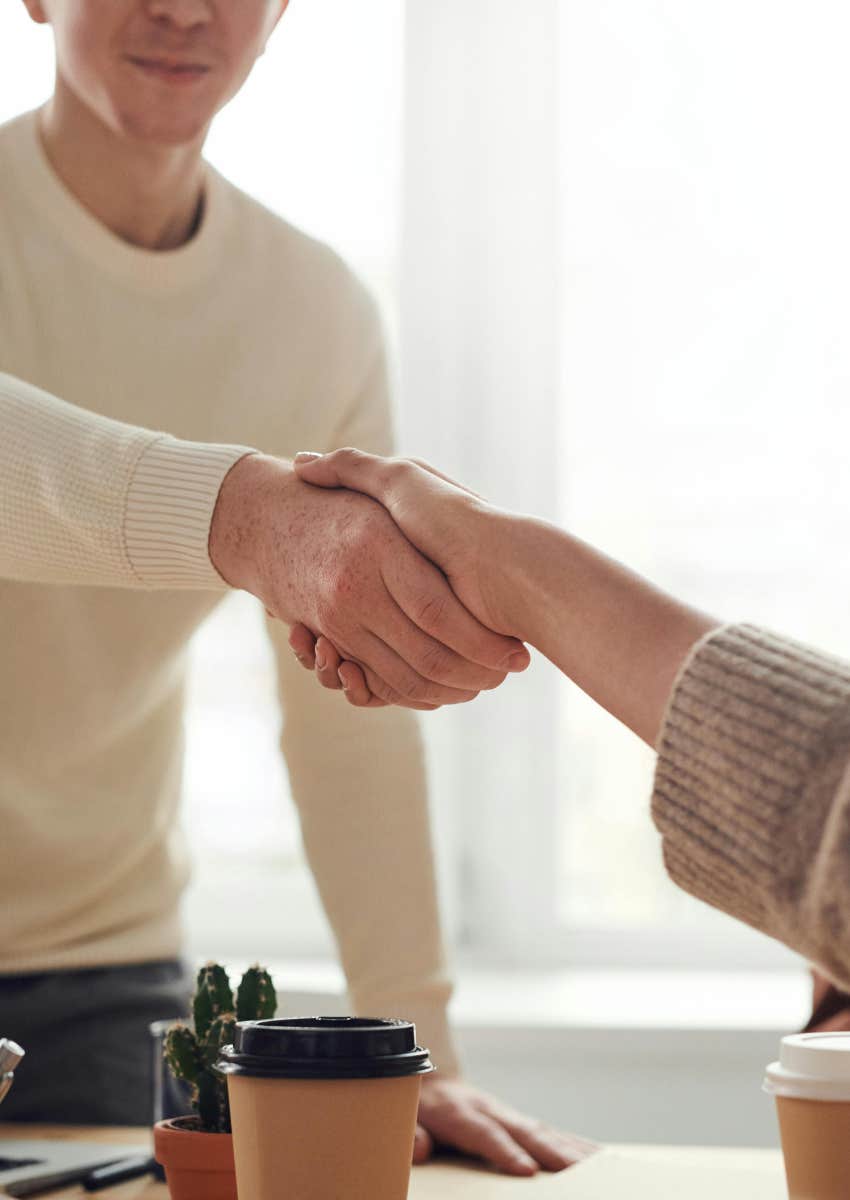 worker shaking hands with boss after quitting