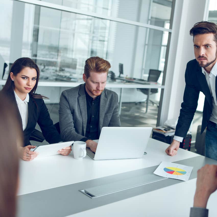 tense work meeting about worker's discussion of pay