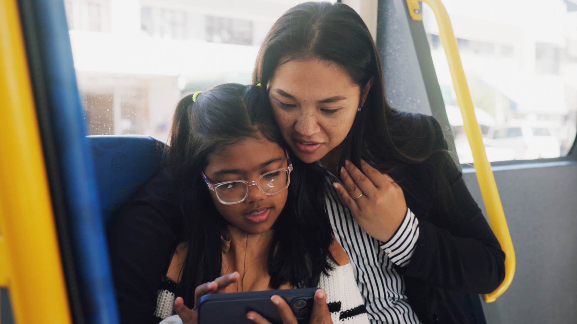 Woman who treated everyone with respect riding the bus with her daughter.