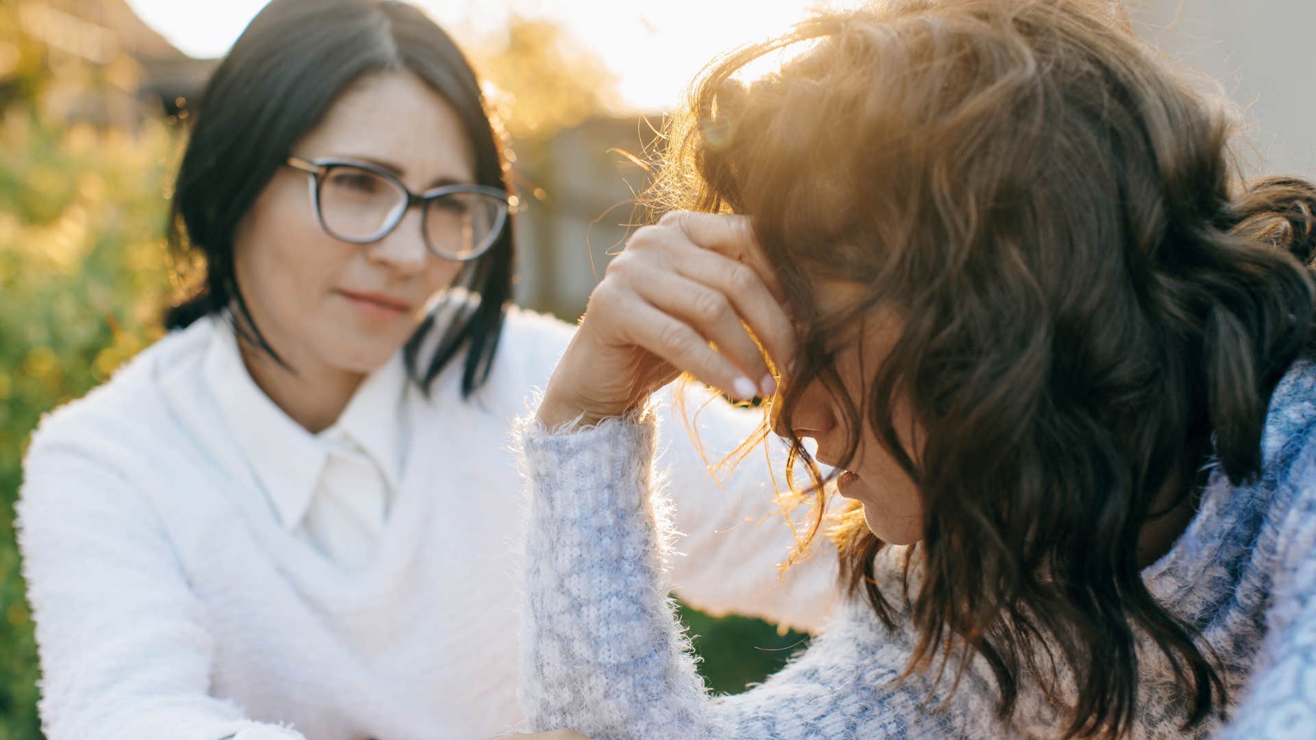 Woman saying "i'm feeling overwhelmed" next to her concerned partner.