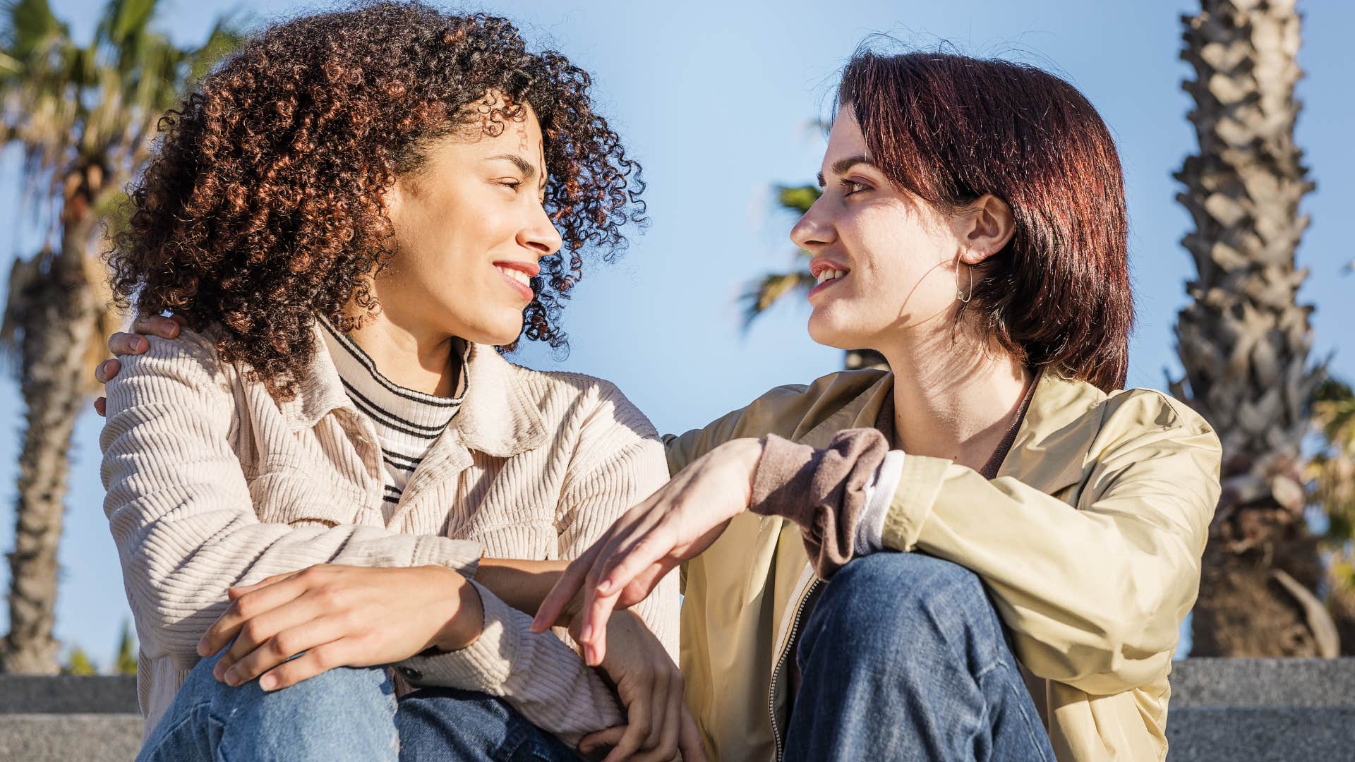 Woman saying "I need some alone time" to her partner outside.