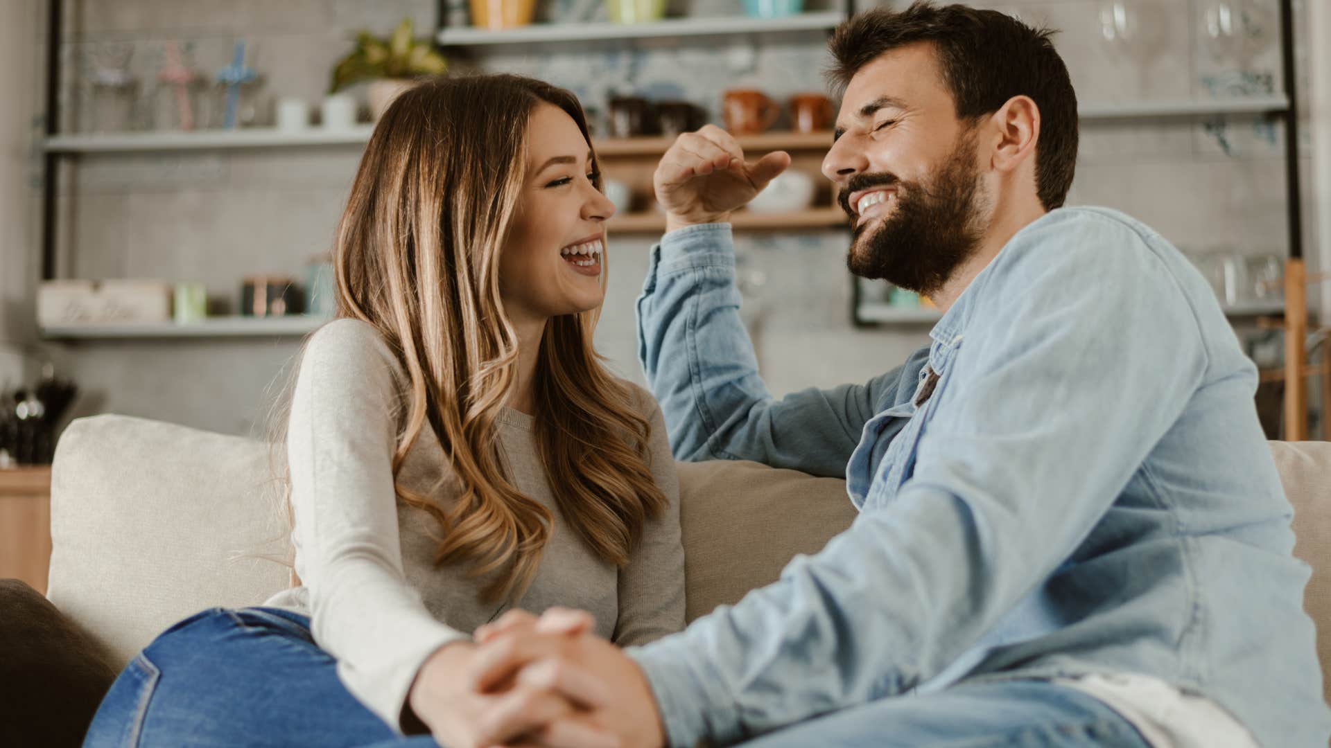 Man saying "let's try something new" while sitting with his wife.