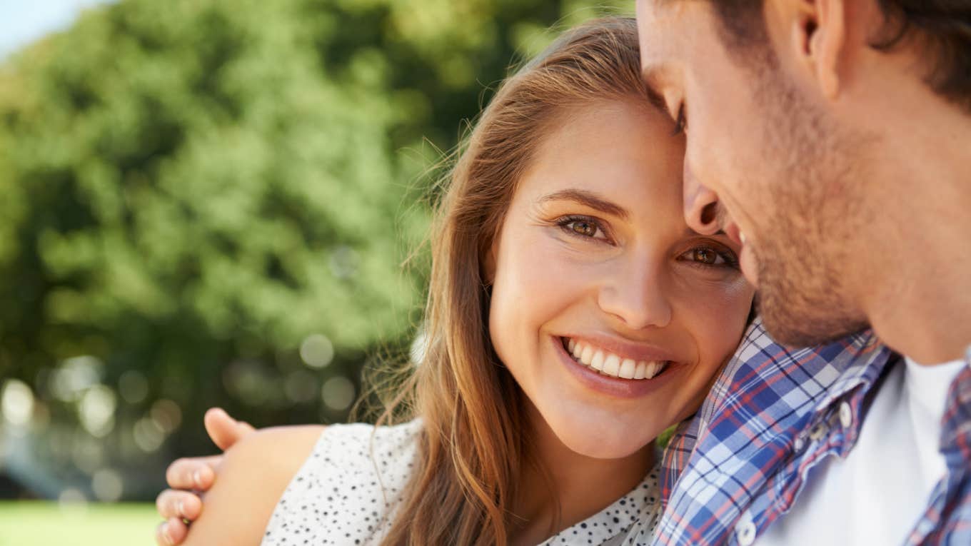You Have A Good Husband If These Things Feel Normal To You woman smiling hugging husband