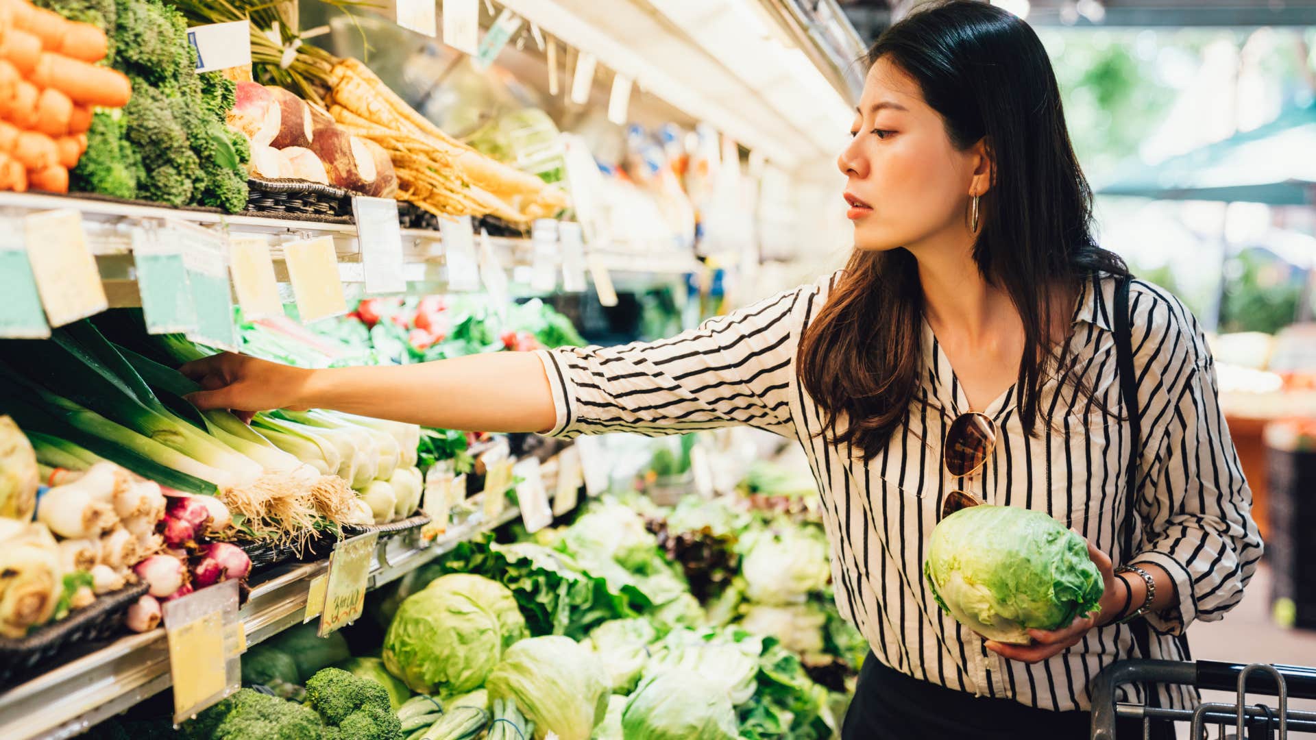 Woman shopping at luxury grocery stores.