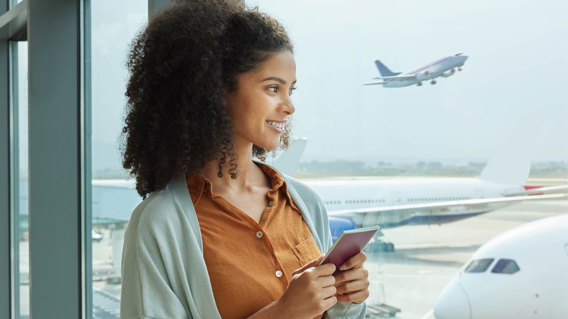Woman who's traveling internationally in an airport.