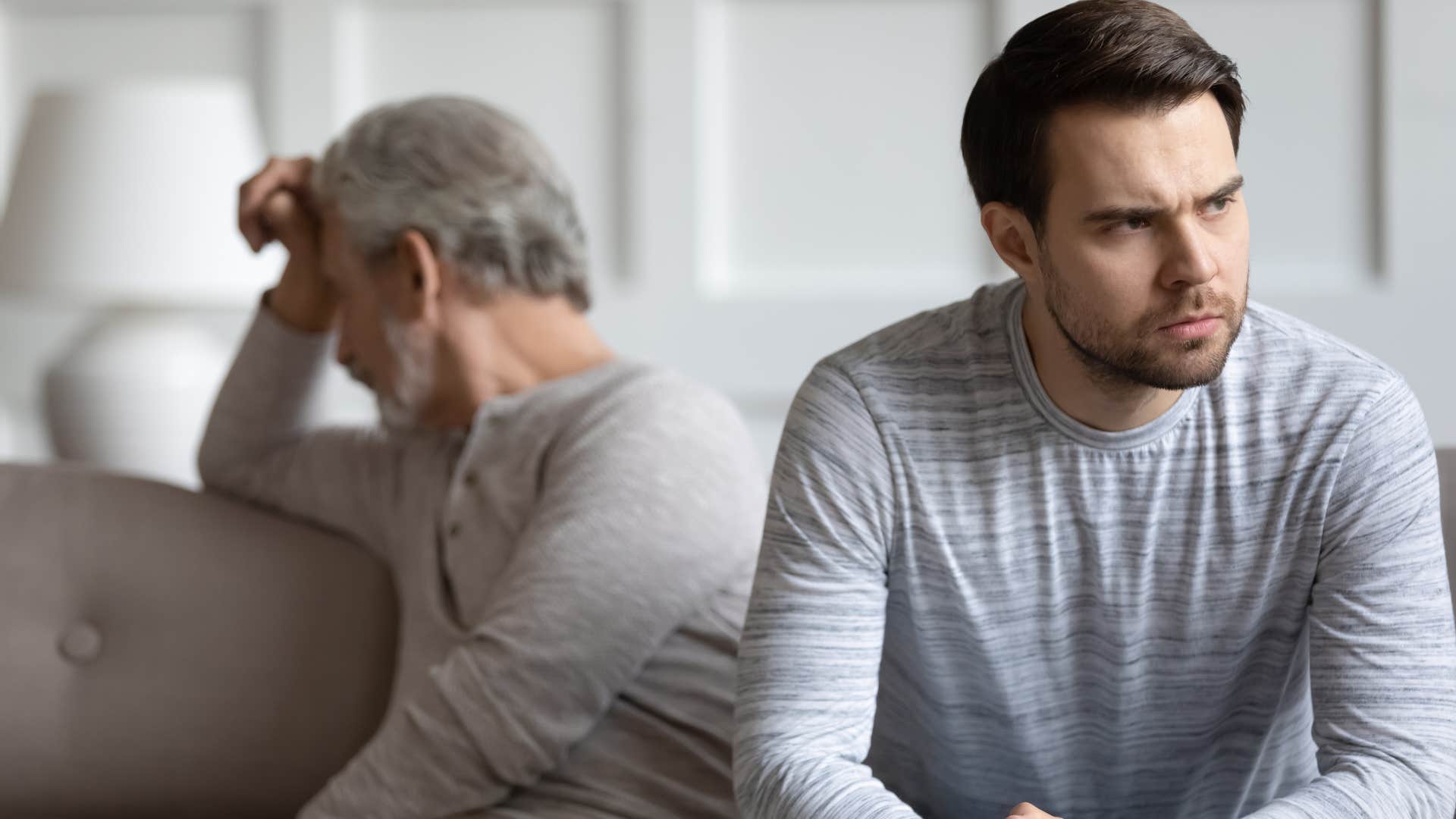 Man who doesn't feel emotionally close turned away from his dad.
