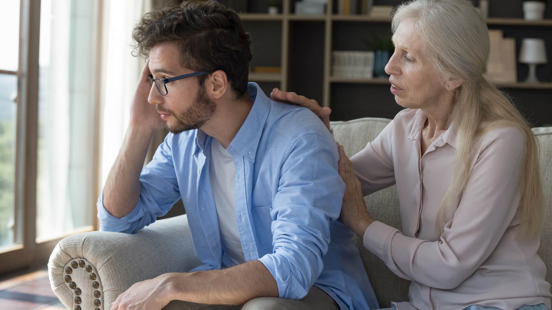 Man saying "I don't want to talk about that right now" to his mother.