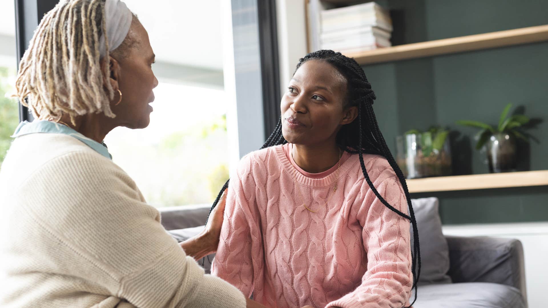 Woman saying "I know you mean well" to her mother.