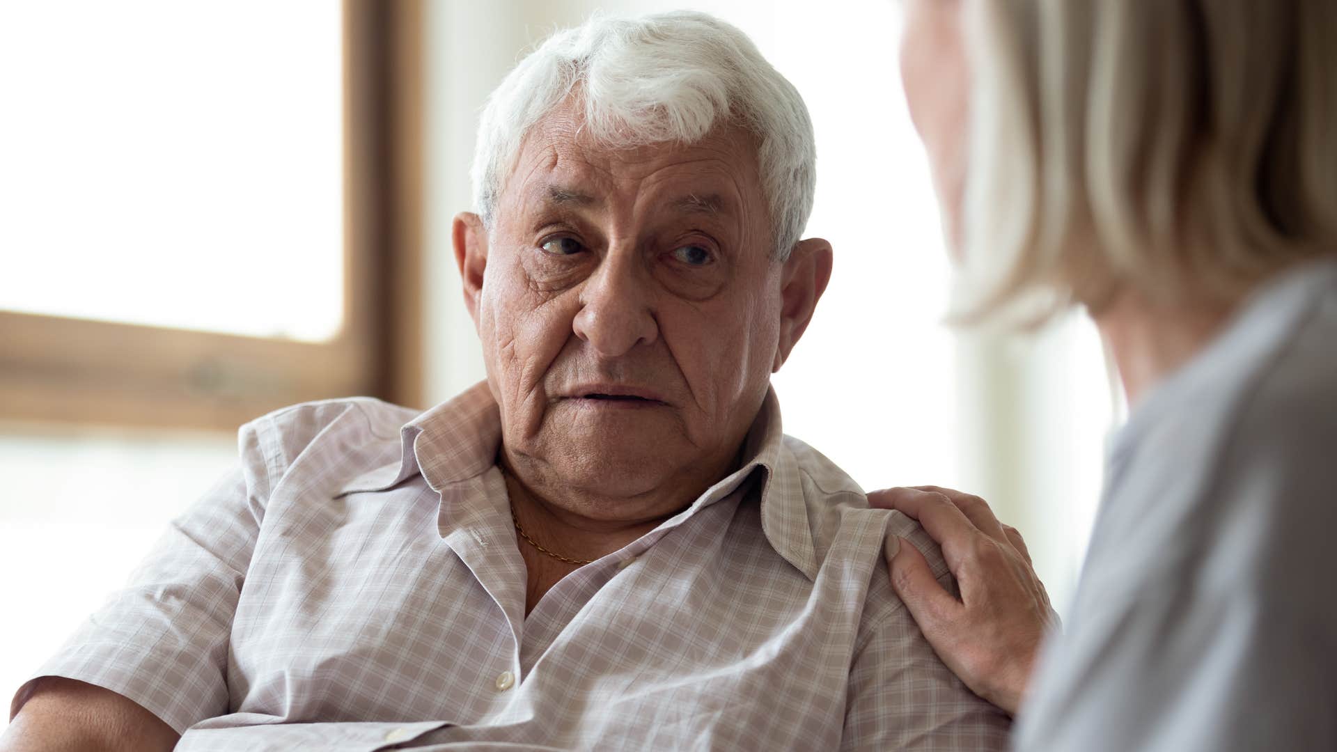 Woman saying "I'll let you know later" to her dad.