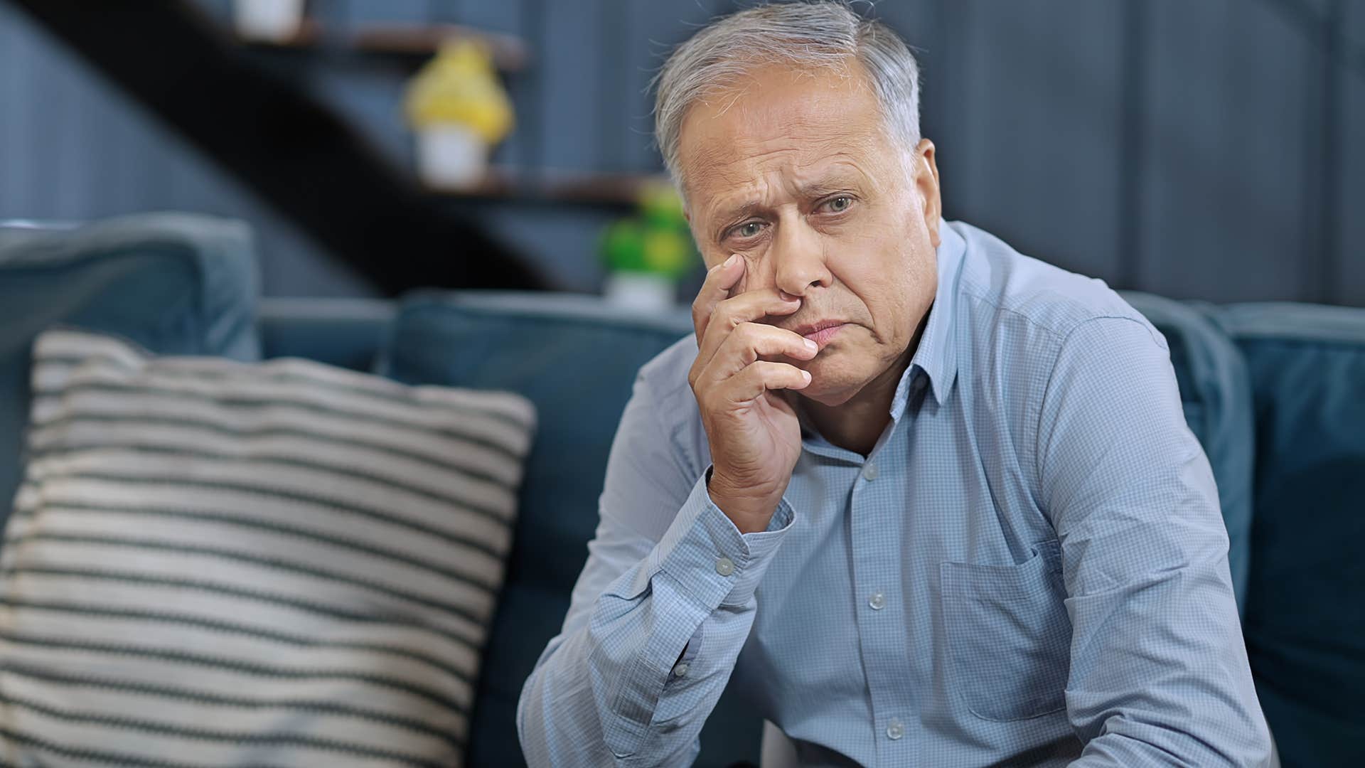 man who always plays the victim sitting on a couch