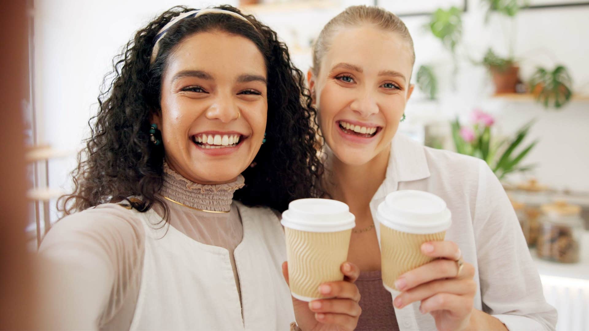 Women with Gen Z spending habits smiling together.