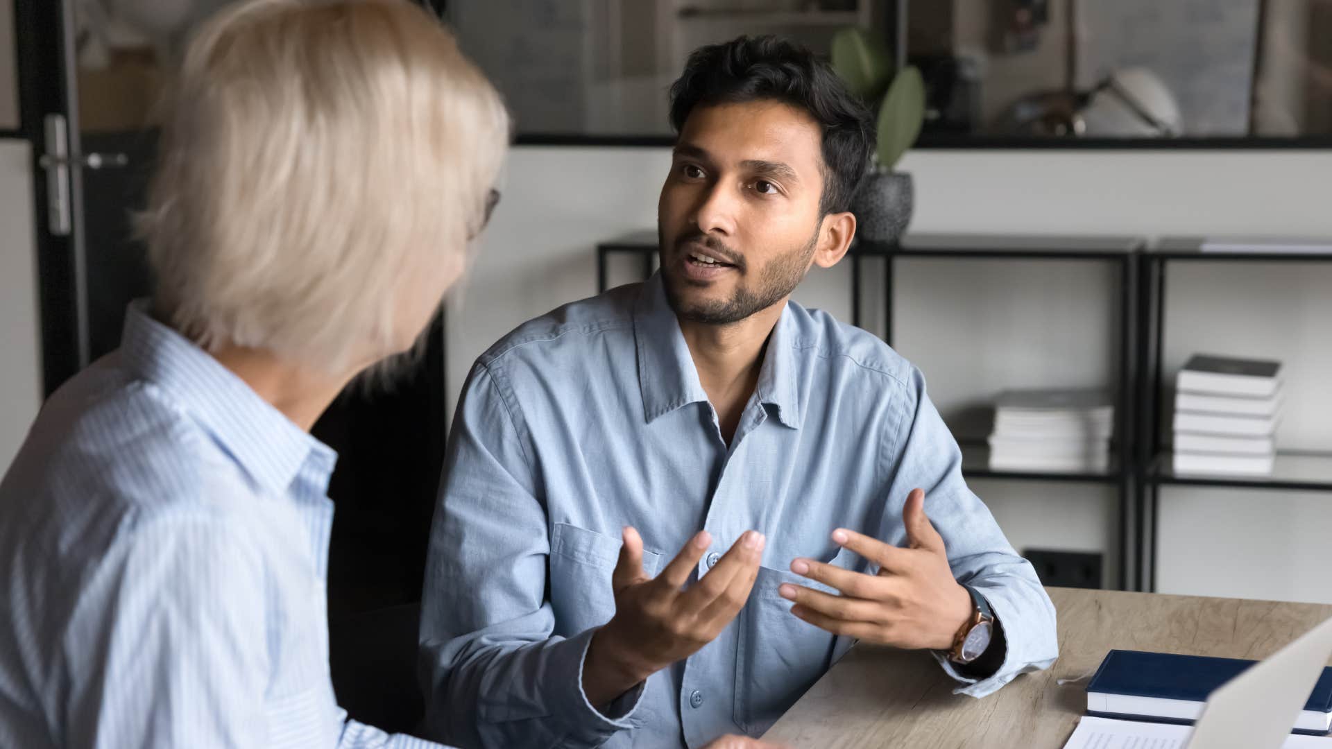 Man saying modern ideas about work-life balance to his boss.