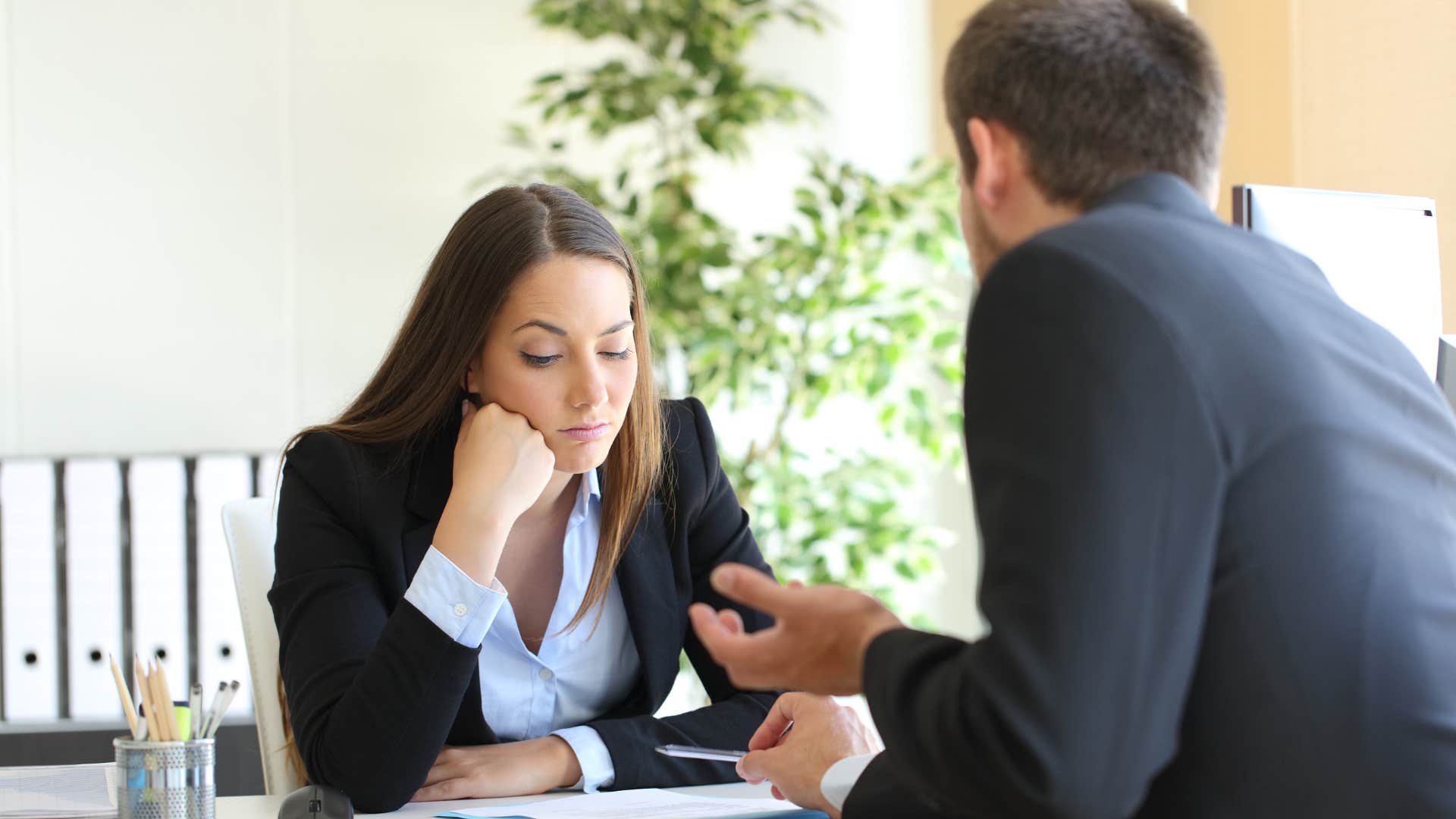 mean boss telling sullen employee to figure it out
