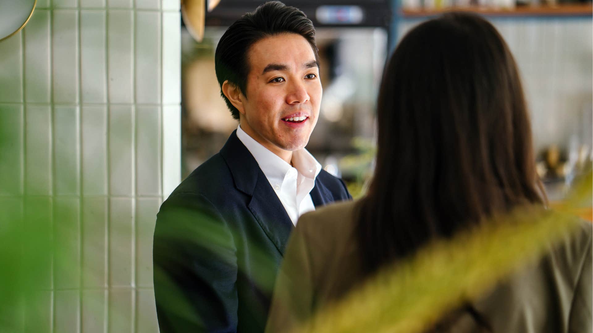 man asking boss for guidance at work