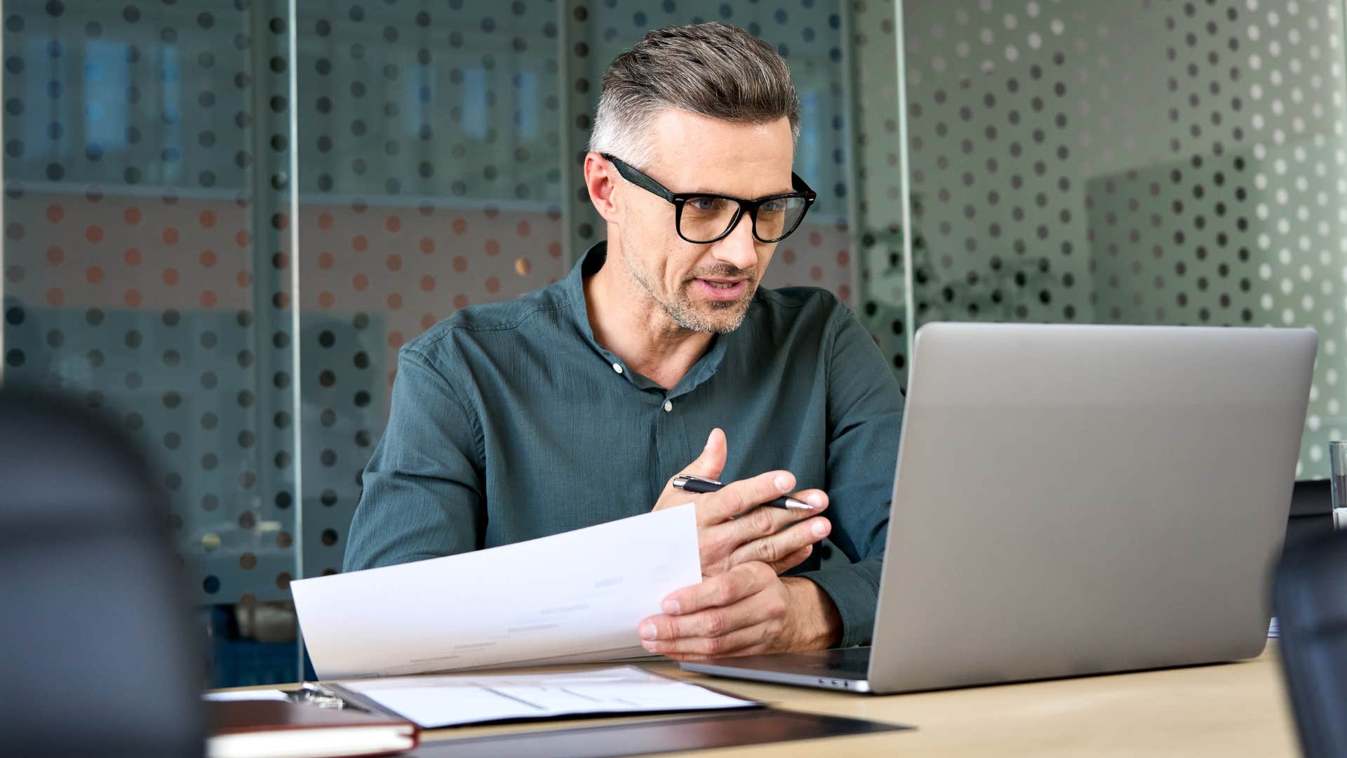 man stressed out discussing delegating tasks to his boss