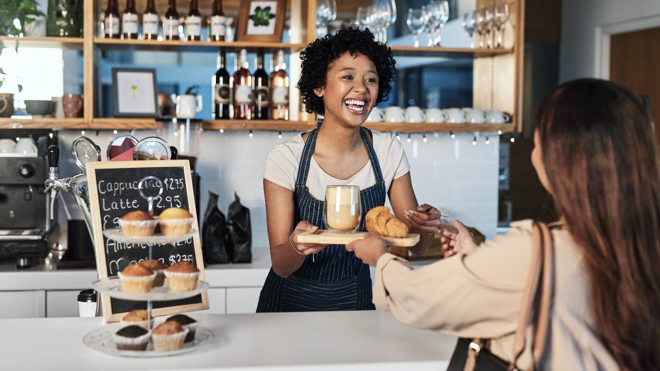 woman ordering coffee from cashier