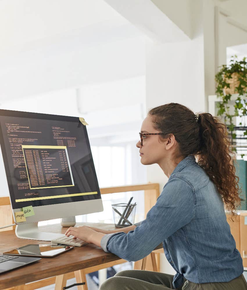 highly intelligent woman writing code
