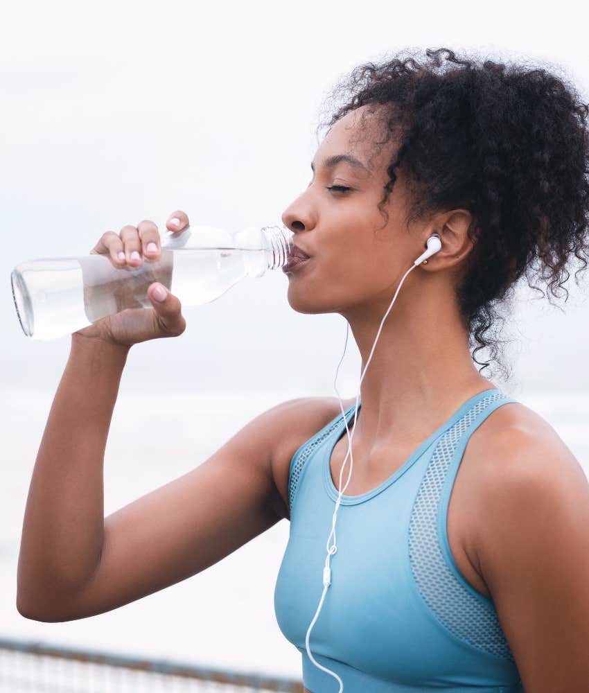 Tired person drinks water